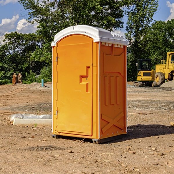 what is the cost difference between standard and deluxe portable toilet rentals in Idanha